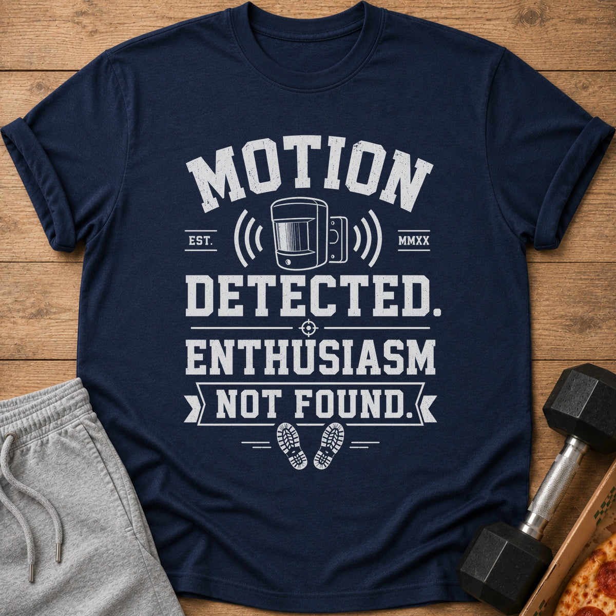 Navy t-shirt with "Motion Detected. Enthusiasm Not Found." graphic and footprints.