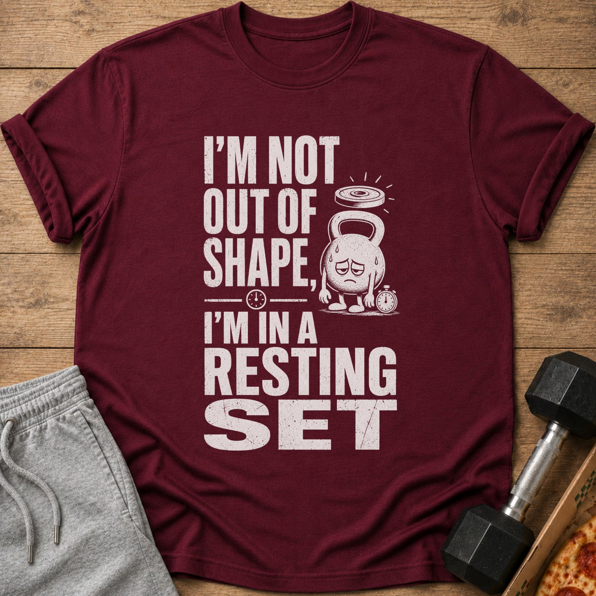 Maroon t-shirt with "I'm not out of shape, I'm in a resting set" text.