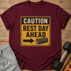Maroon t-shirt with "CAUTION REST DAY AHEAD" and foam roller graphic.