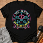 Black t-shirt with "30% Lifting 70% Talking to Myself Certified Gym Procrastinator" neon graphic.