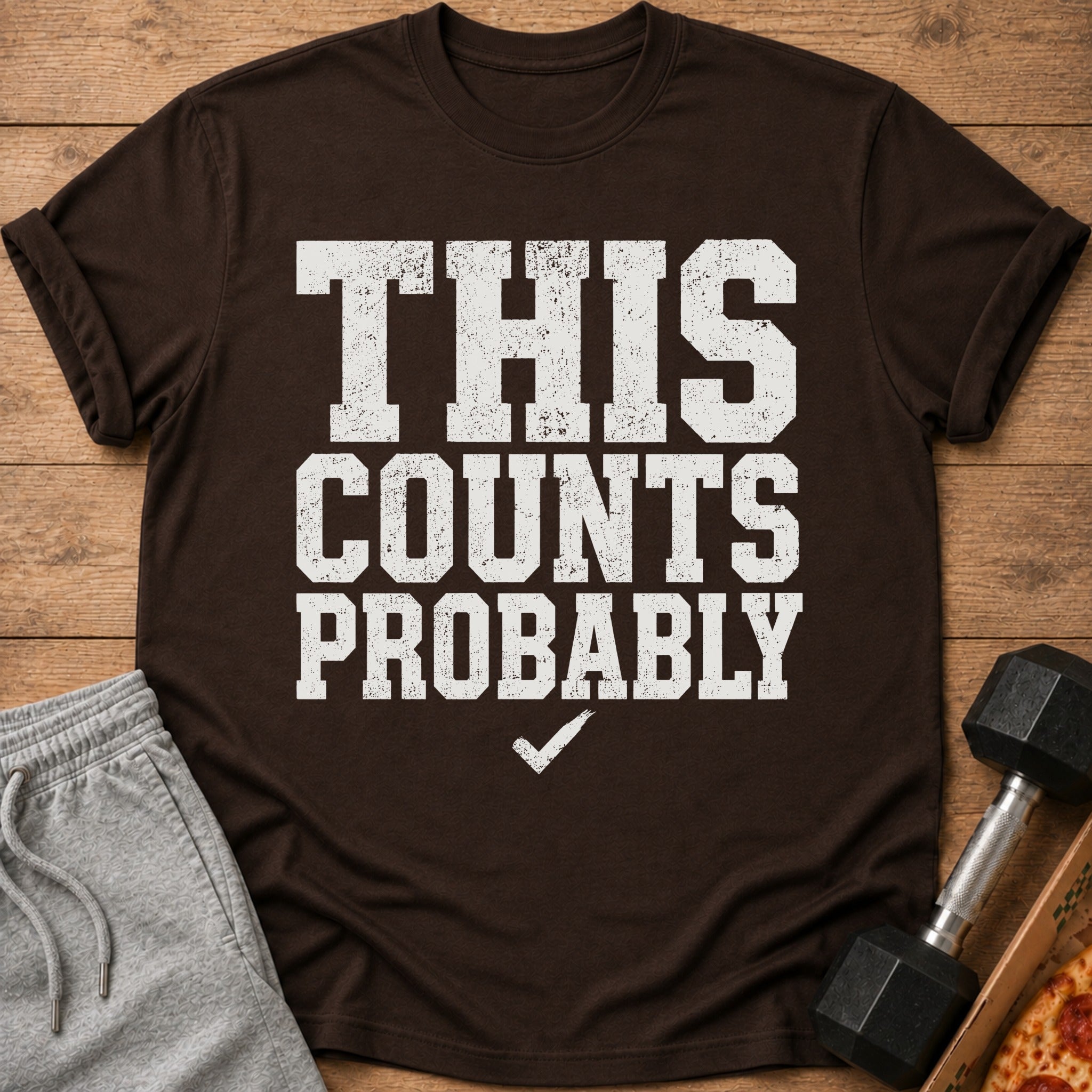 Brown t-shirt with "THIS COUNTS PROBABLY" text and a checkmark.