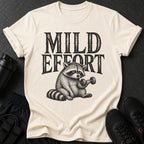 Cream t-shirt with black text "MILD EFFORT" and a raccoon lifting a dumbbell.
