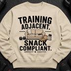 Sweatshirt with "Training Adjacent. Snack Compliant." text, couch, pizza, dumbbell, and shaker.