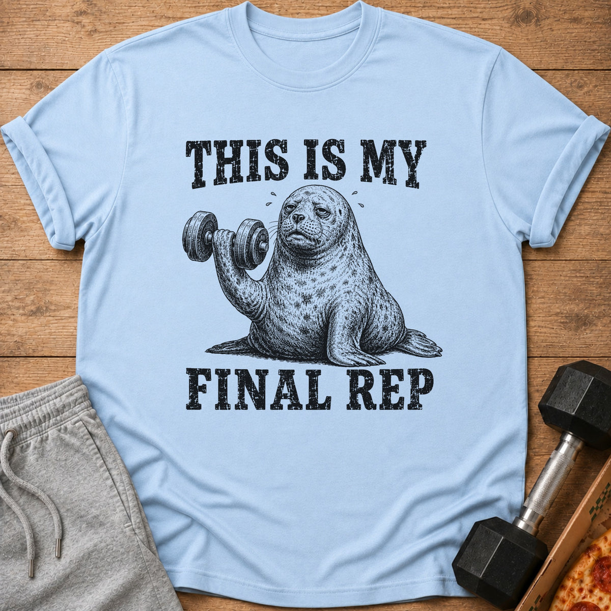 Light blue t-shirt with a seal lifting a dumbbell, text "THIS IS MY FINAL REP".