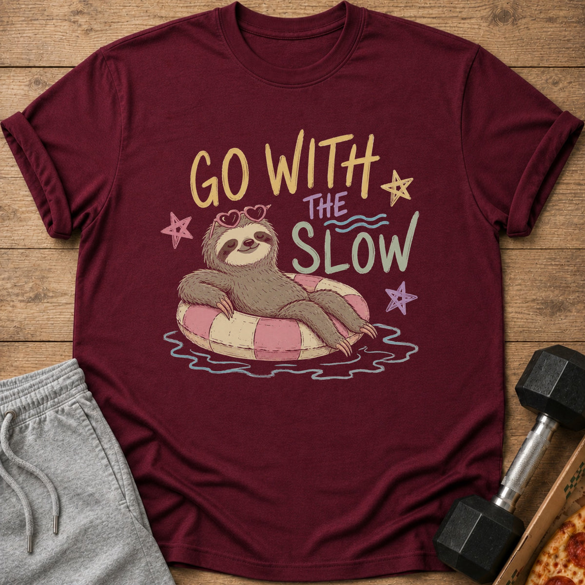 Maroon t-shirt with sloth on inner tube and text "GO WITH THE SLOW".
