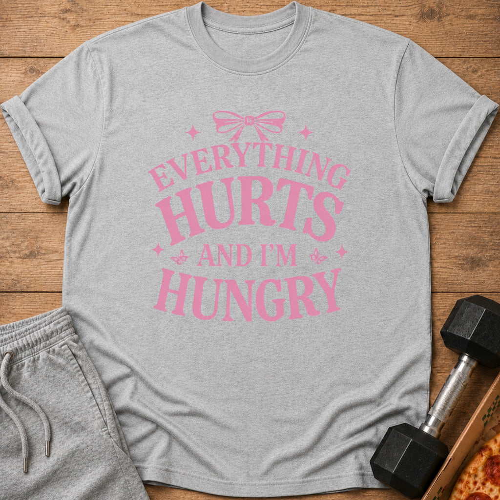 Grey t-shirt with pink text "Everything Hurts And I'm Hungry"