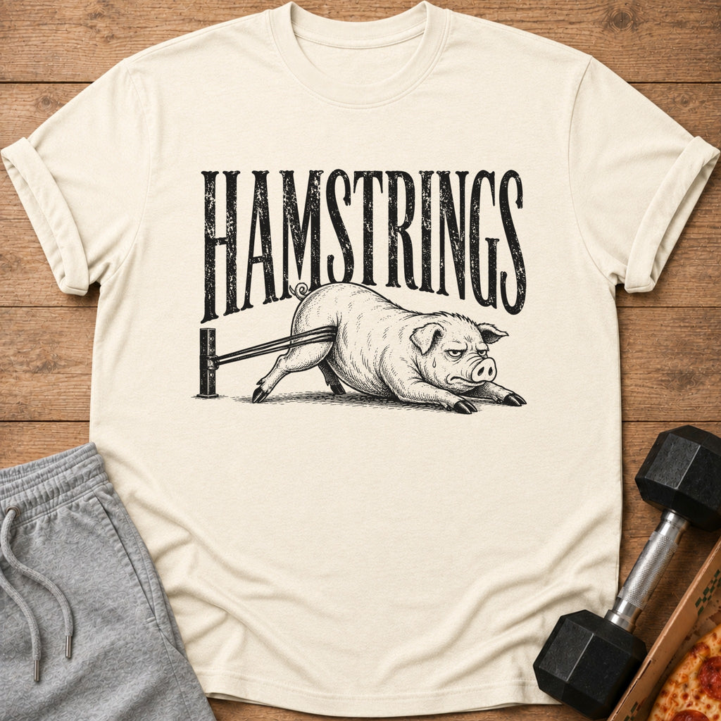 T-shirt with "HAMSTRINGS" text and a pig struggling with resistance bands.