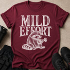 Maroon t-shirt with "MILD EFFORT" and a raccoon lifting a dumbbell.