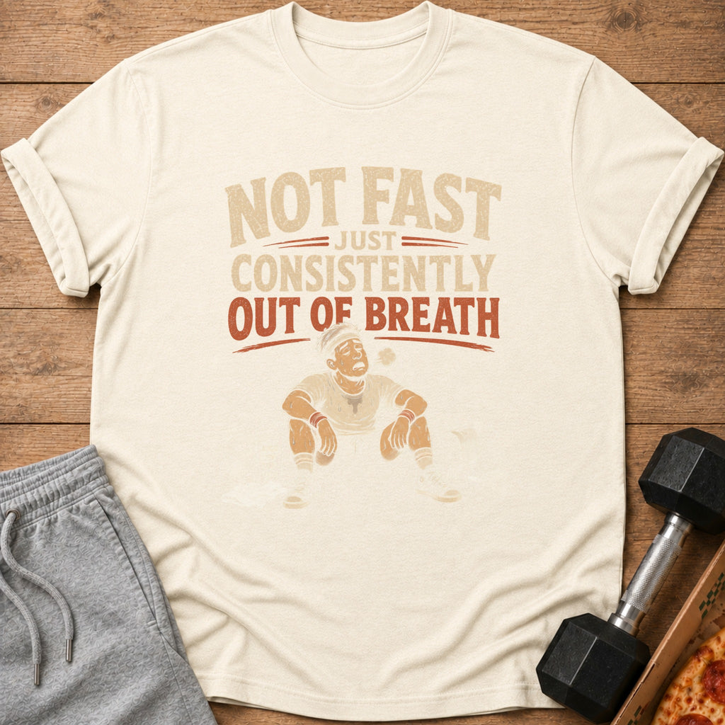 Light-colored t-shirt with text "NOT FAST JUST CONSISTENTLY OUT OF BREATH" and graphic.