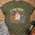 Green t-shirt with ghost graphic saying "Too Tired to Be Terrifying."