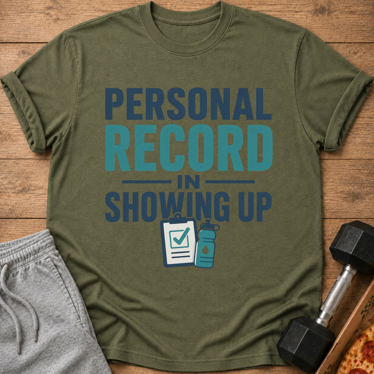 Green t-shirt with "PERSONAL RECORD IN SHOWING UP" text and gym icons.