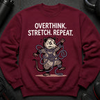 Maroon sweatshirt with a tangled opossum graphic and text that reads "OVERTHINK. STRETCH. REPEAT."