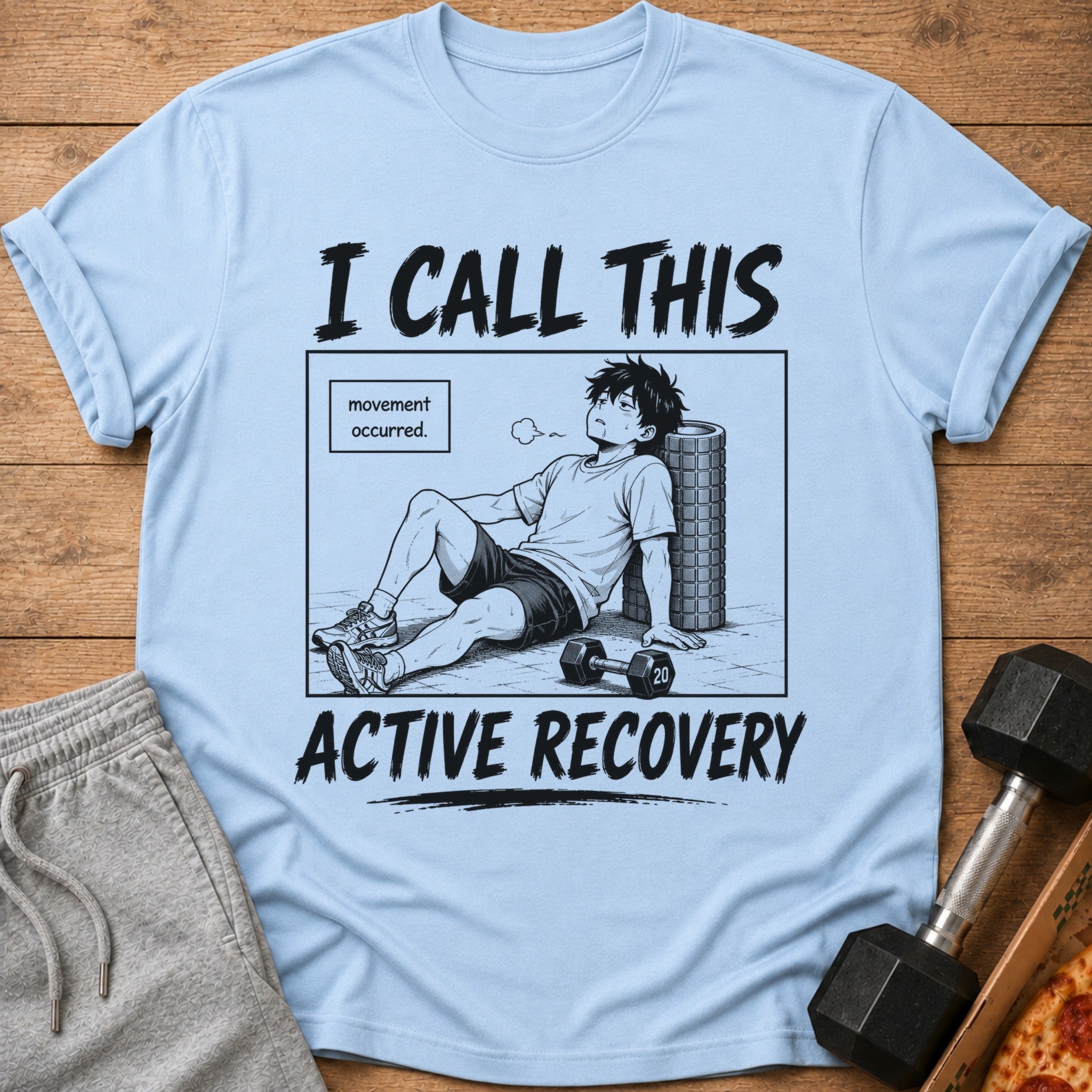 Light blue t-shirt with a manga-style graphic of a tired man and text.