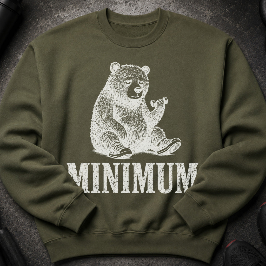 Olive green sweatshirt with a distressed white graphic of a tired bear holding a dumbbell, and the word MINIMUM.