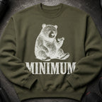 Olive green sweatshirt with a distressed white graphic of a tired bear holding a dumbbell, and the word MINIMUM.