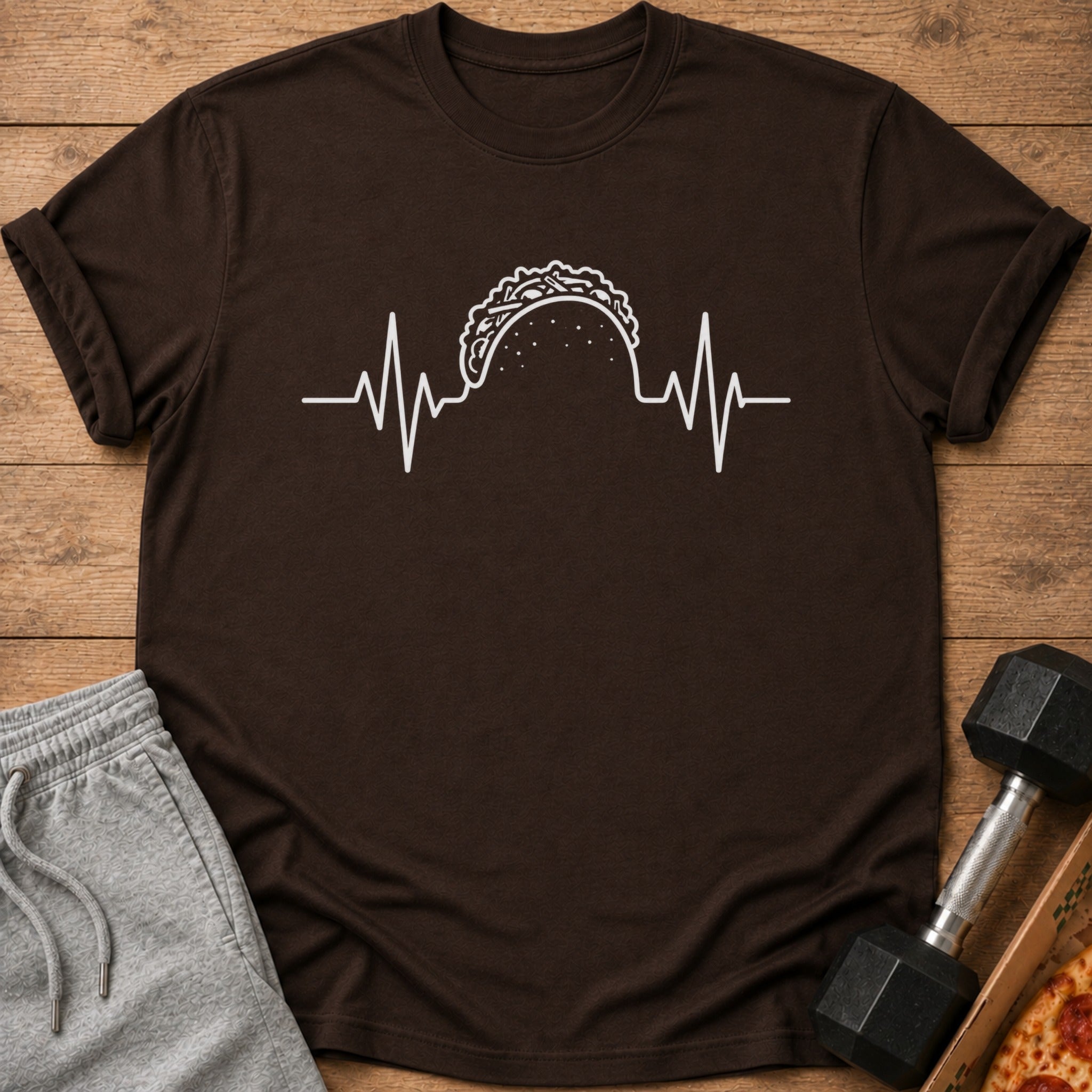 Brown t-shirt with white taco and heartbeat graphic.