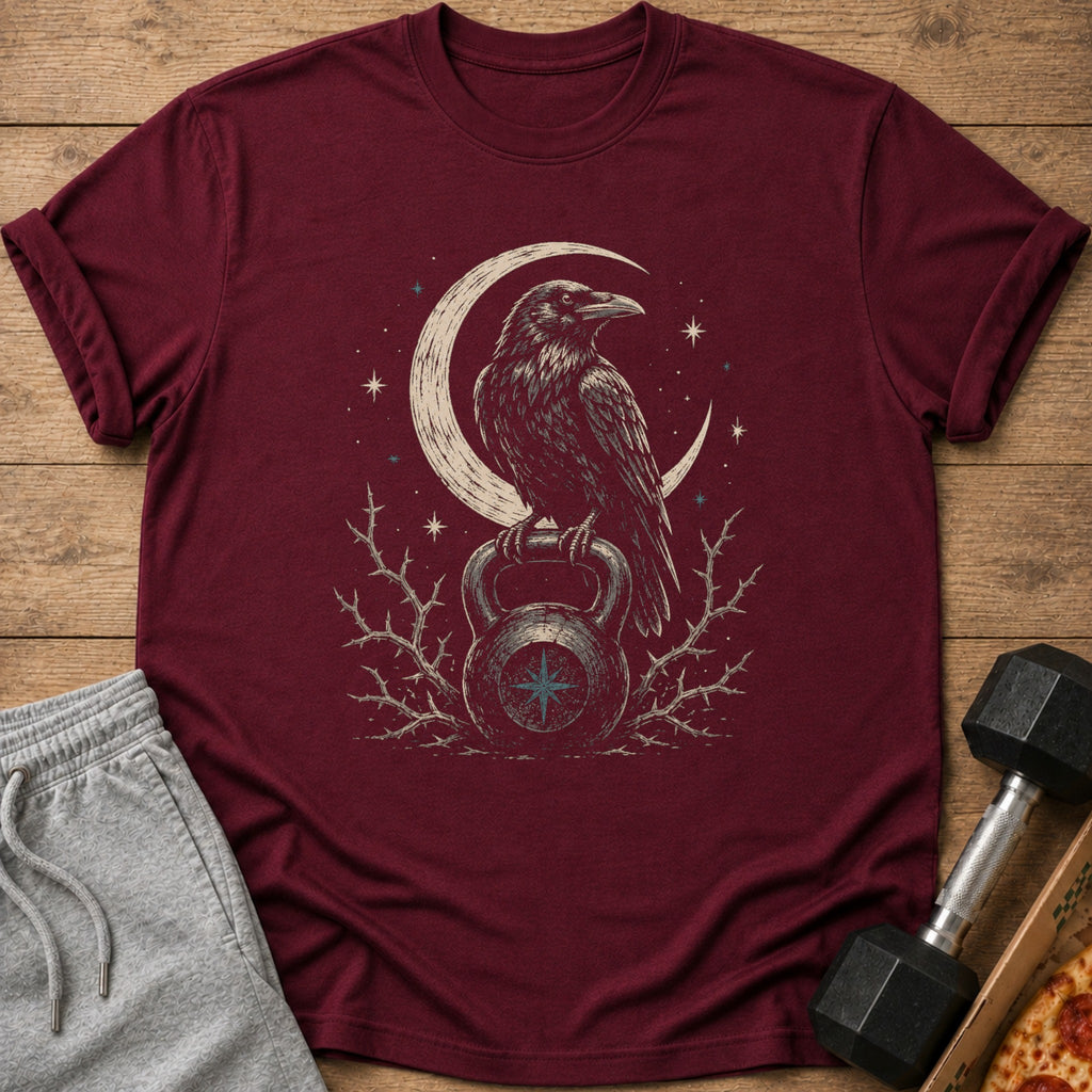 Maroon t-shirt with crow on kettlebell and crescent moon graphic.