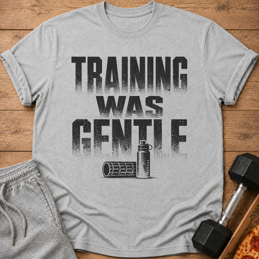 Grey t-shirt with "TRAINING WAS GENTLE" text, water bottle, and foam roller.