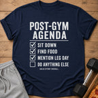 Navy t-shirt with "Post-Gym Agenda" checklist: sit down, find food, mention leg day.