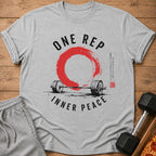 Grey t-shirt with "ONE REP INNER PEACE" text, barbell, and red circle design.