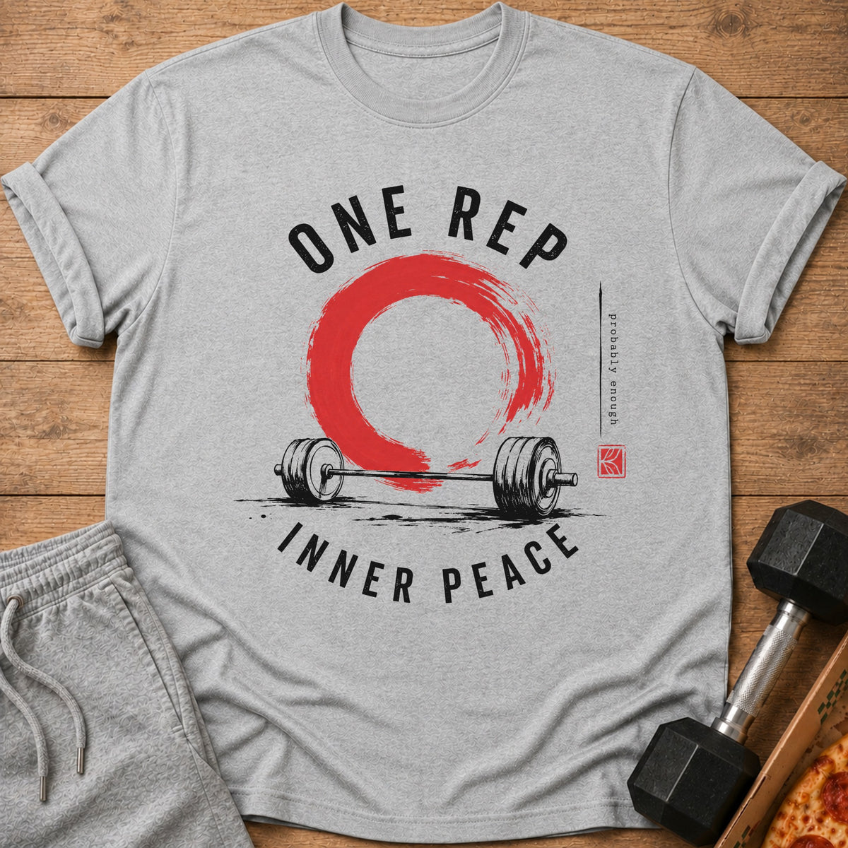 Grey t-shirt with "ONE REP INNER PEACE" text, barbell, and red circle design.