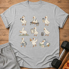 Gray t-shirt with cartoon ducks lifting weights, doing yoga, and eating pizza.