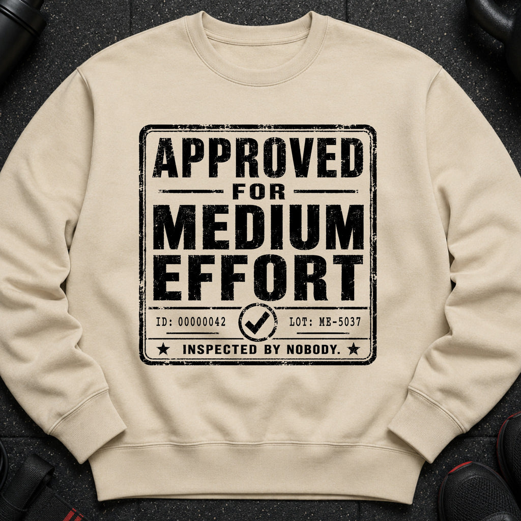 Tan sweatshirt with distressed black text: "APPROVED FOR MEDIUM EFFORT".