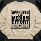 Tan sweatshirt with distressed black text: "APPROVED FOR MEDIUM EFFORT".