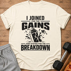 Cream t-shirt with black text: "I JOINED FOR THE GAINS AND STAYED FOR THE BREAKDOWN".