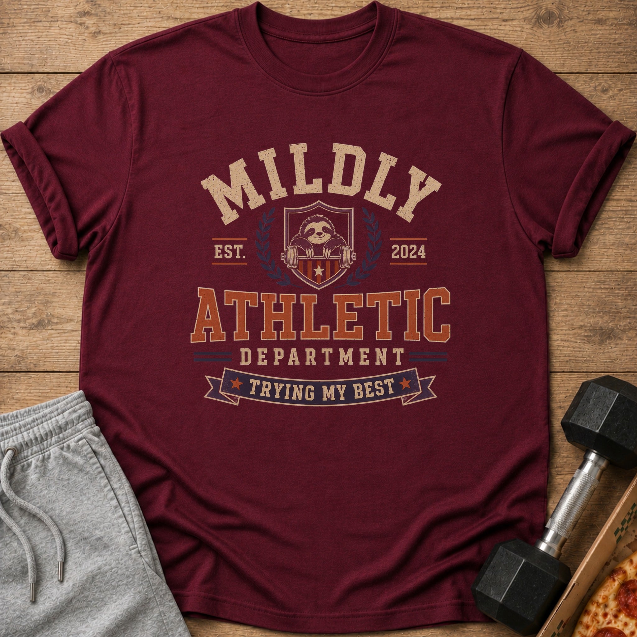 Maroon t-shirt with "MILDLY ATHLETIC DEPARTMENT TRYING MY BEST" text and sloth graphic.