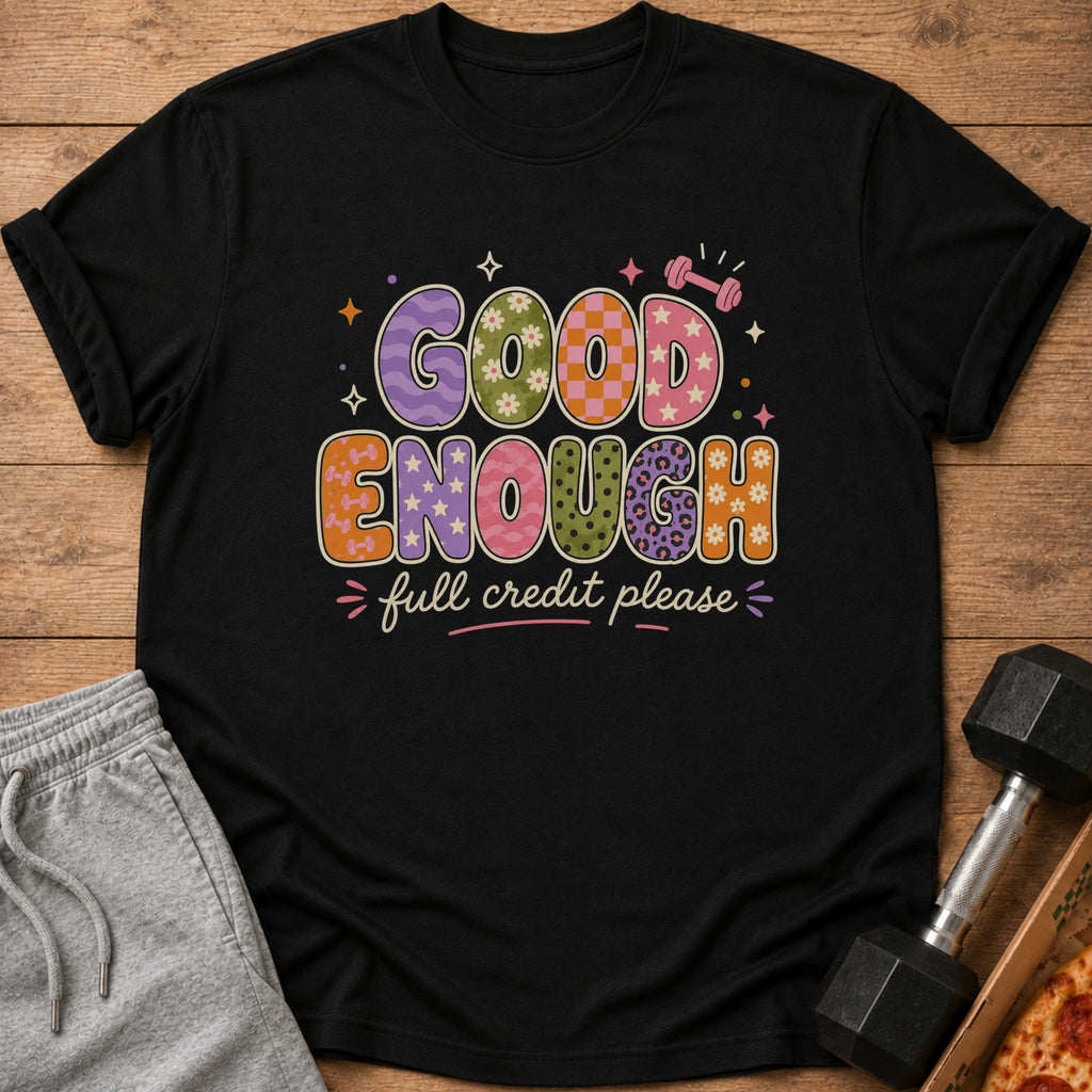 Black t-shirt with "Good Enough full credit please" text and retro patterns.
