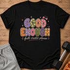 Black t-shirt with "Good Enough full credit please" text and retro patterns.