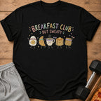 Black t-shirt with "Breakfast Club But Sweaty" text and cartoon breakfast foods exercising.