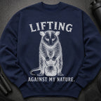 Navy sweatshirt with distressed graphic of animal lifting kettlebell and text.