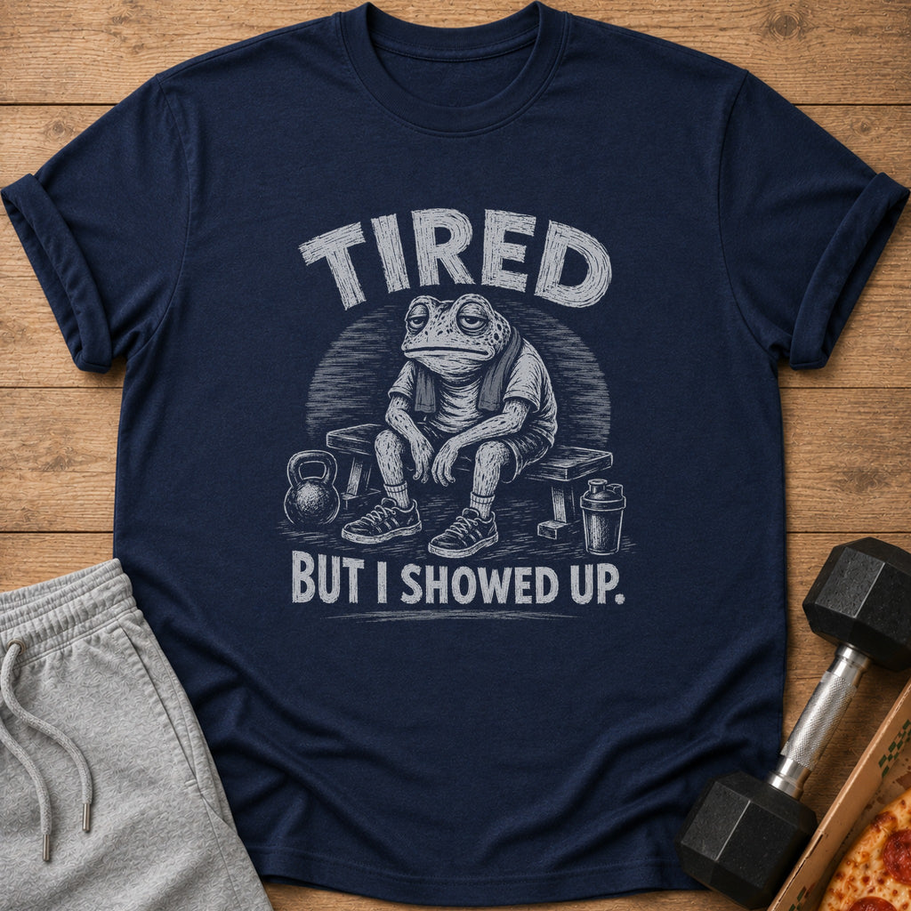 Dark blue t-shirt with text "TIRED BUT I SHOWED UP." and frog graphic.