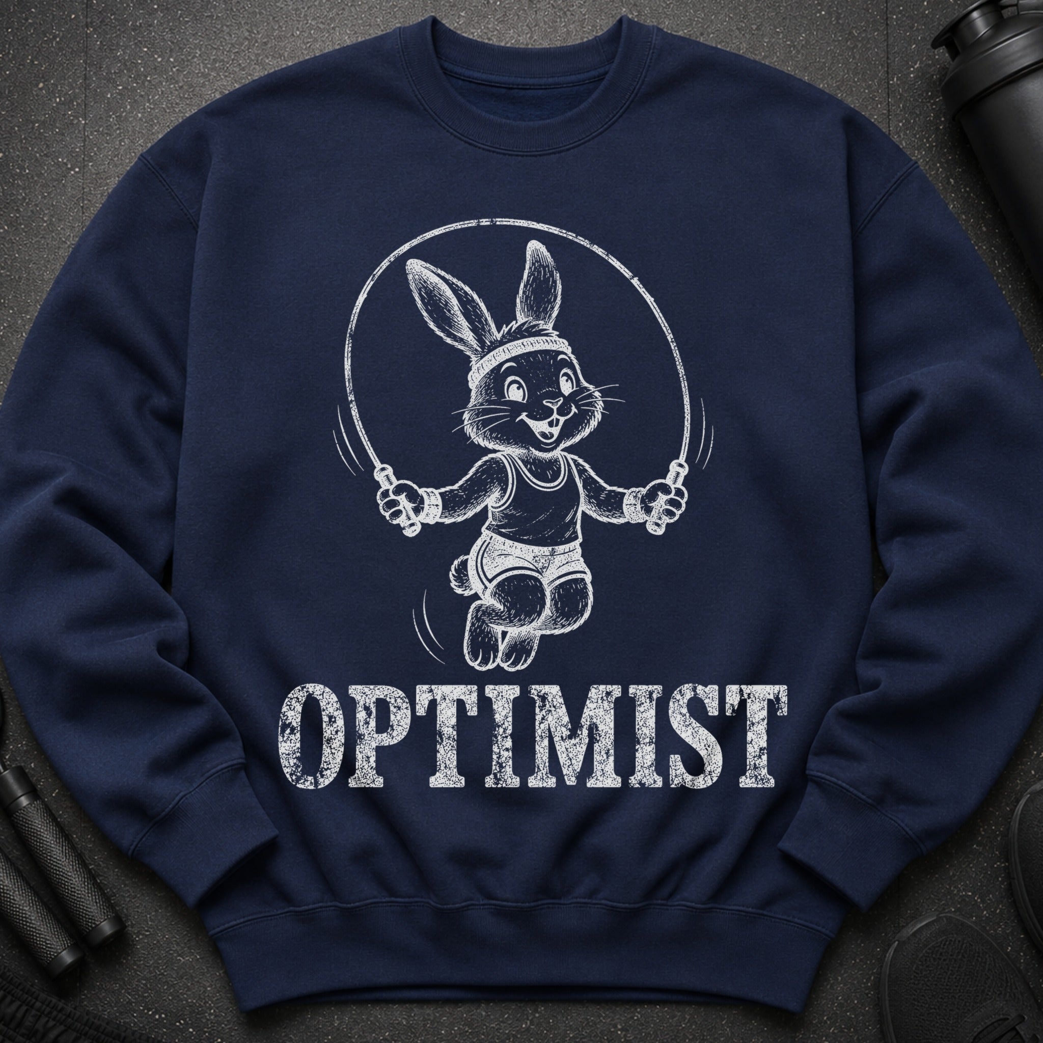 Navy sweatshirt with a white graphic of a rabbit jumping rope and the word "OPTIMIST".