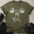 Olive green t-shirt with a white raccoon lifting a barbell graphic.