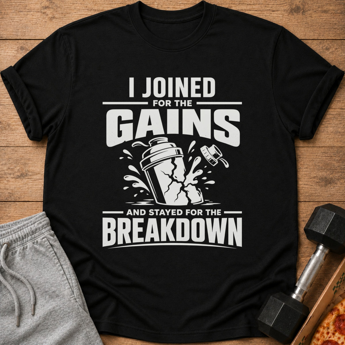 Black t-shirt with white text "I Joined for the Gains and Stayed for the Breakdown".