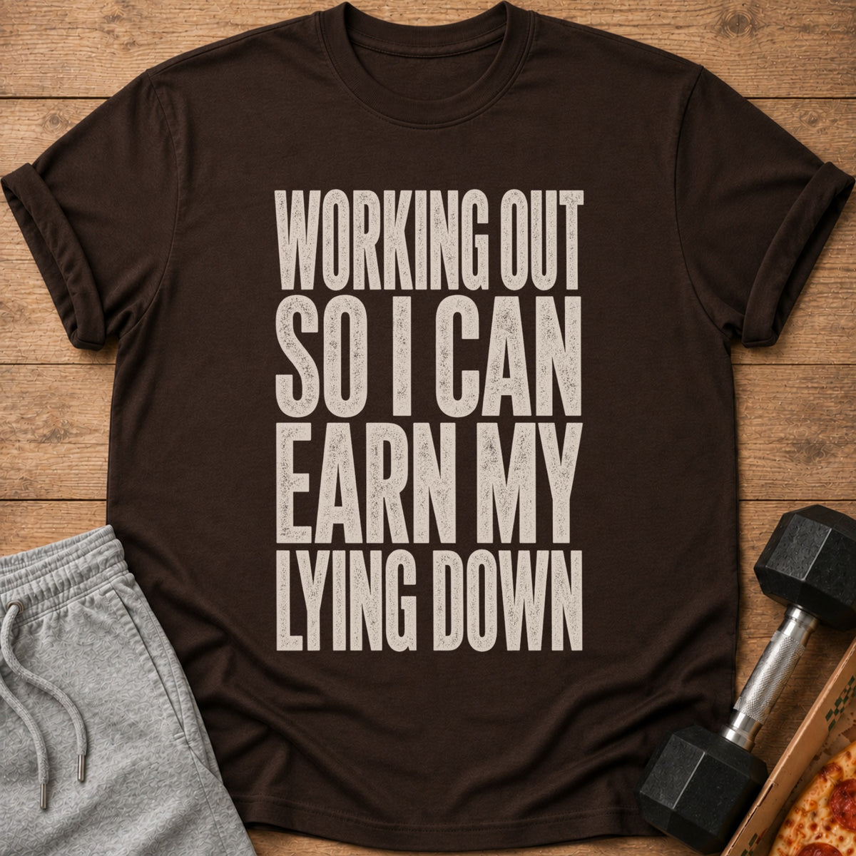 Brown t-shirt with text "WORKING OUT SO I CAN EARN MY LYING DOWN."