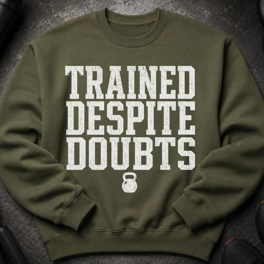 Green sweatshirt with white text "TRAINED DESPITE DOUBTS" and a kettlebell graphic.