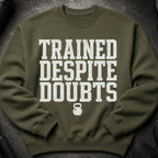 Green sweatshirt with white text "TRAINED DESPITE DOUBTS" and a kettlebell graphic.