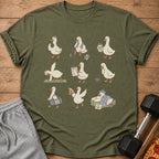 T-shirt with cartoon ducks exercising, eating pizza, and resting.