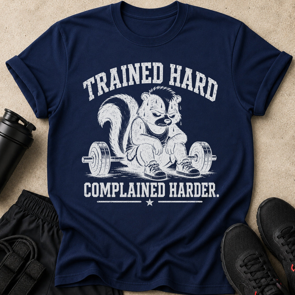 Navy t-shirt with graphic of a skunk sitting by a barbell, text reads "TRAINED HARD COMPLAINED HARDER."