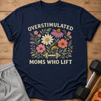 Navy t-shirt with floral graphic and text "OVERSTIMULATED MOMS WHO LIFT".