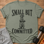T-shirt with a meerkat lifting weights and text "SMALL BUT COMMITTED."