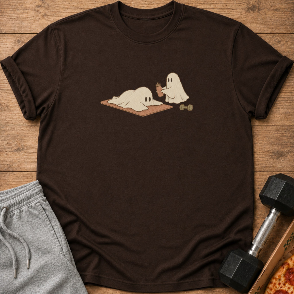 Brown t-shirt with graphic of two ghosts working out and a dumbbell