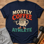 "Mostly Coffee Athlete" text on a navy t-shirt with a cartoon coffee mug lifting a dumbbell.