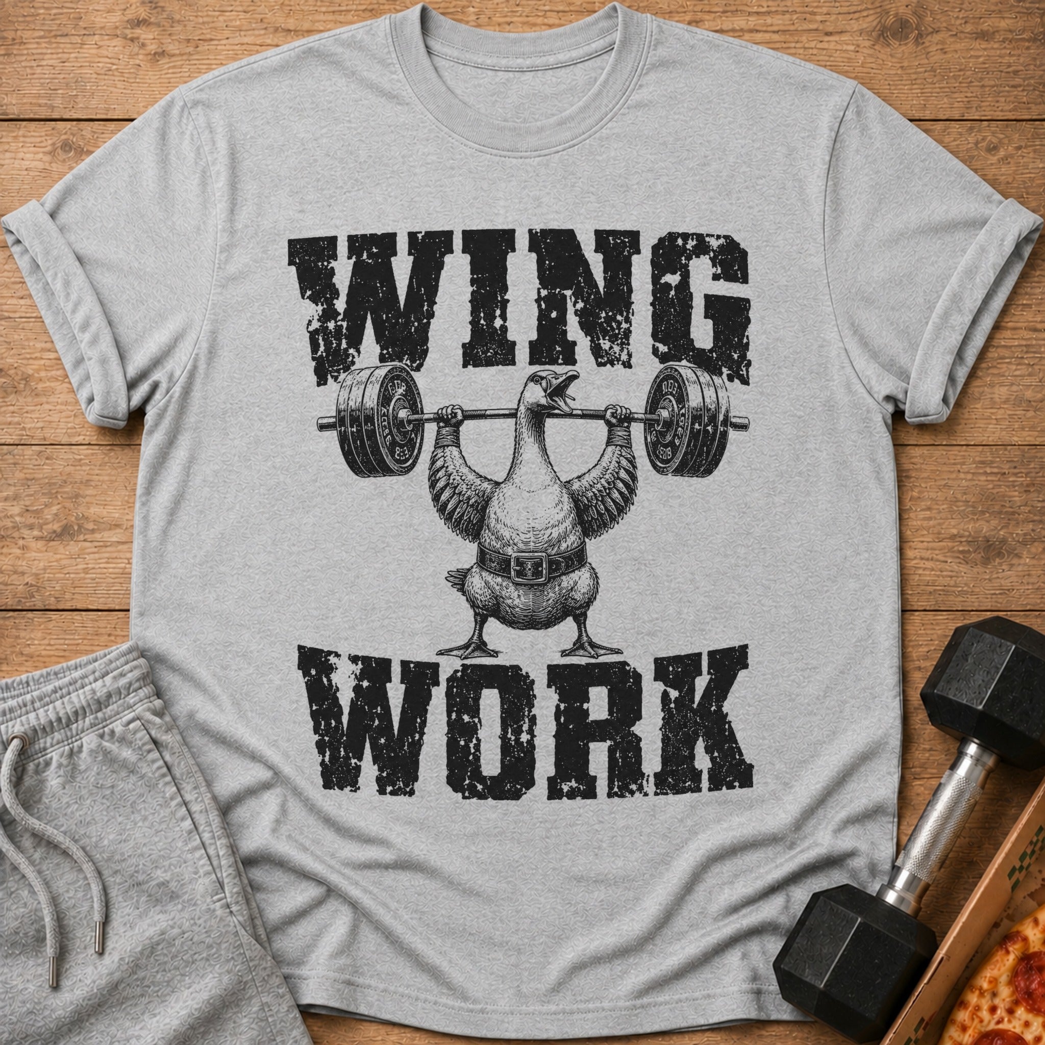 Gray t-shirt with black text "WING WORK" and a duck lifting weights.