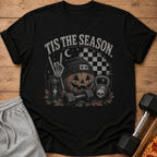 Black t-shirt with Halloween fitness graphic: "Tis the Season", pumpkin, dumbbells, kettlebell.