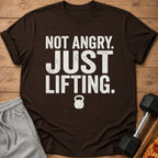 Brown t-shirt with distressed white text "NOT ANGRY. JUST LIFTING." and a kettlebell icon.